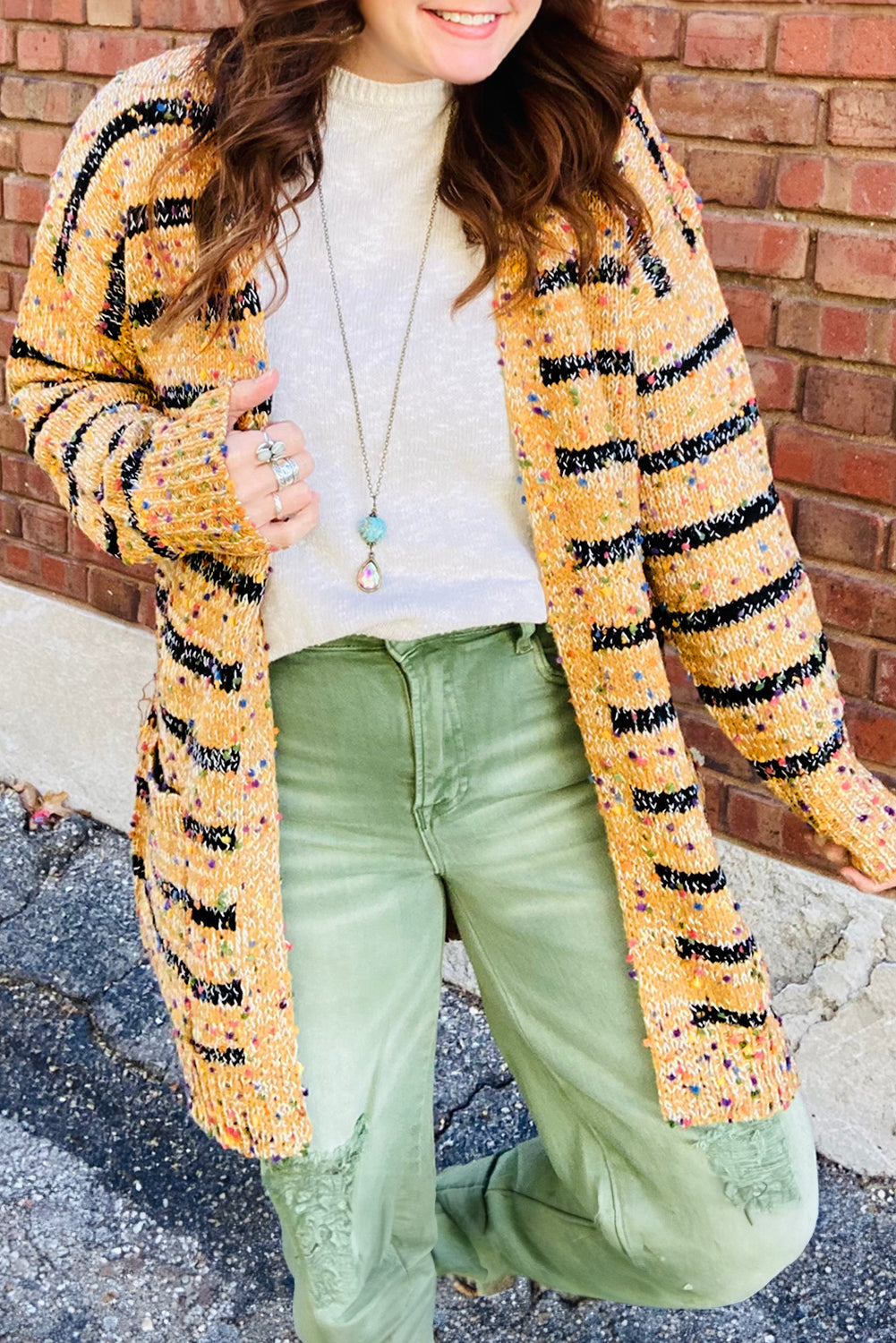 Beige striped pom pom knit long cardigan with open front by Dear-Lover, featuring cozy, stylish design and playful pom pom details.