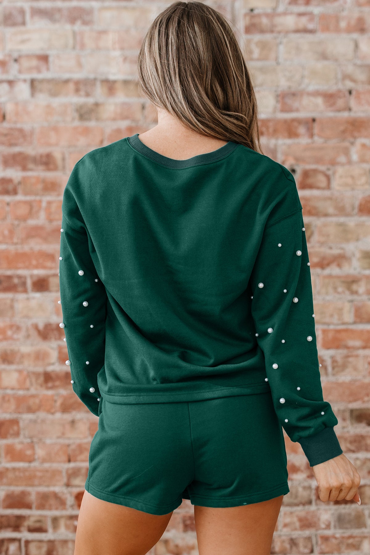 Dark green pearl-embellished drop shoulder pullover and elastic waist mini skort set by Dear-Lover, stylish two-piece dress ensemble.