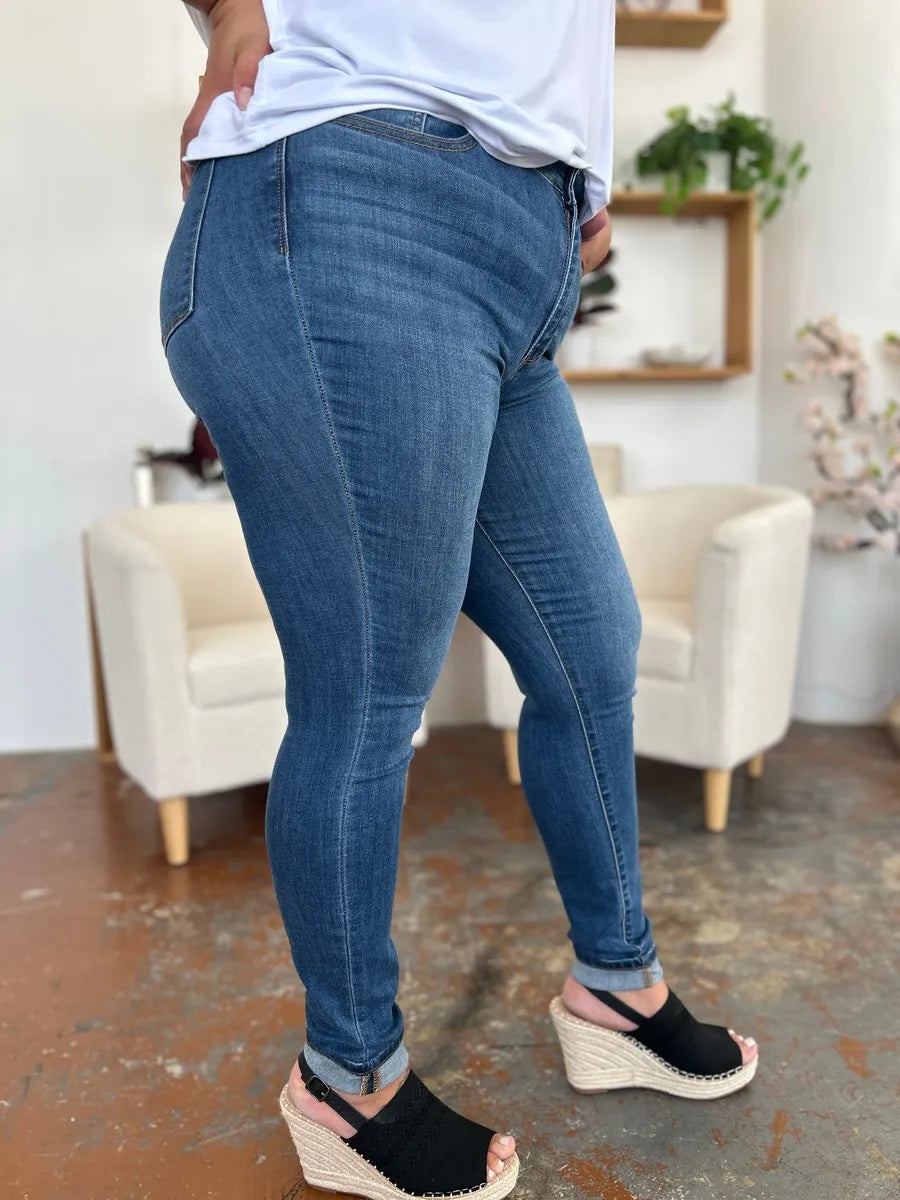 Judy Blue full size cuffed hem skinny jeans for women, showing a close-up of the fitted denim with cuffed ankle detail.