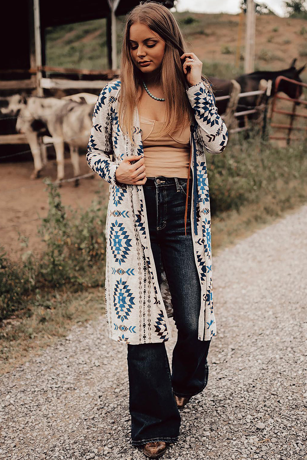 Sky blue Western Aztec printed open front long cardigan by Dear-Lover, featuring bold geometric patterns and a relaxed fit.