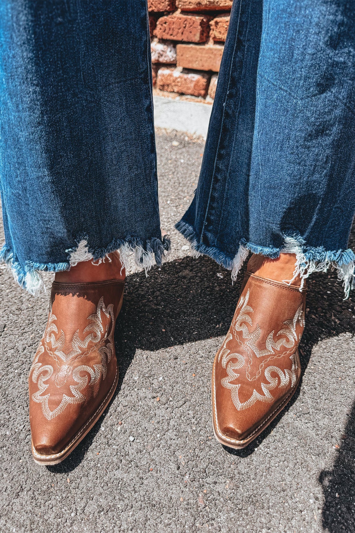 Dear-Lover Ashleigh Blue High Waist Flared Jeans with frayed hem, stylish denim bottoms featuring a fitted high waist and flare leg design.