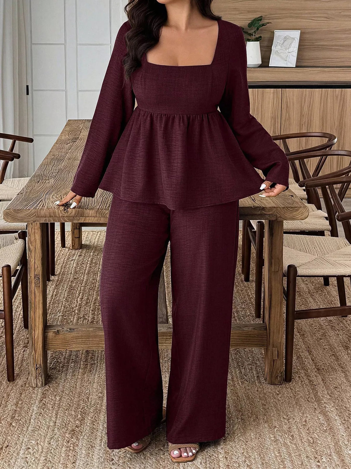 Plus size square neck long sleeve top and pants two-piece set by Trendsi, featuring a stylish, coordinated outfit in soft fabric.