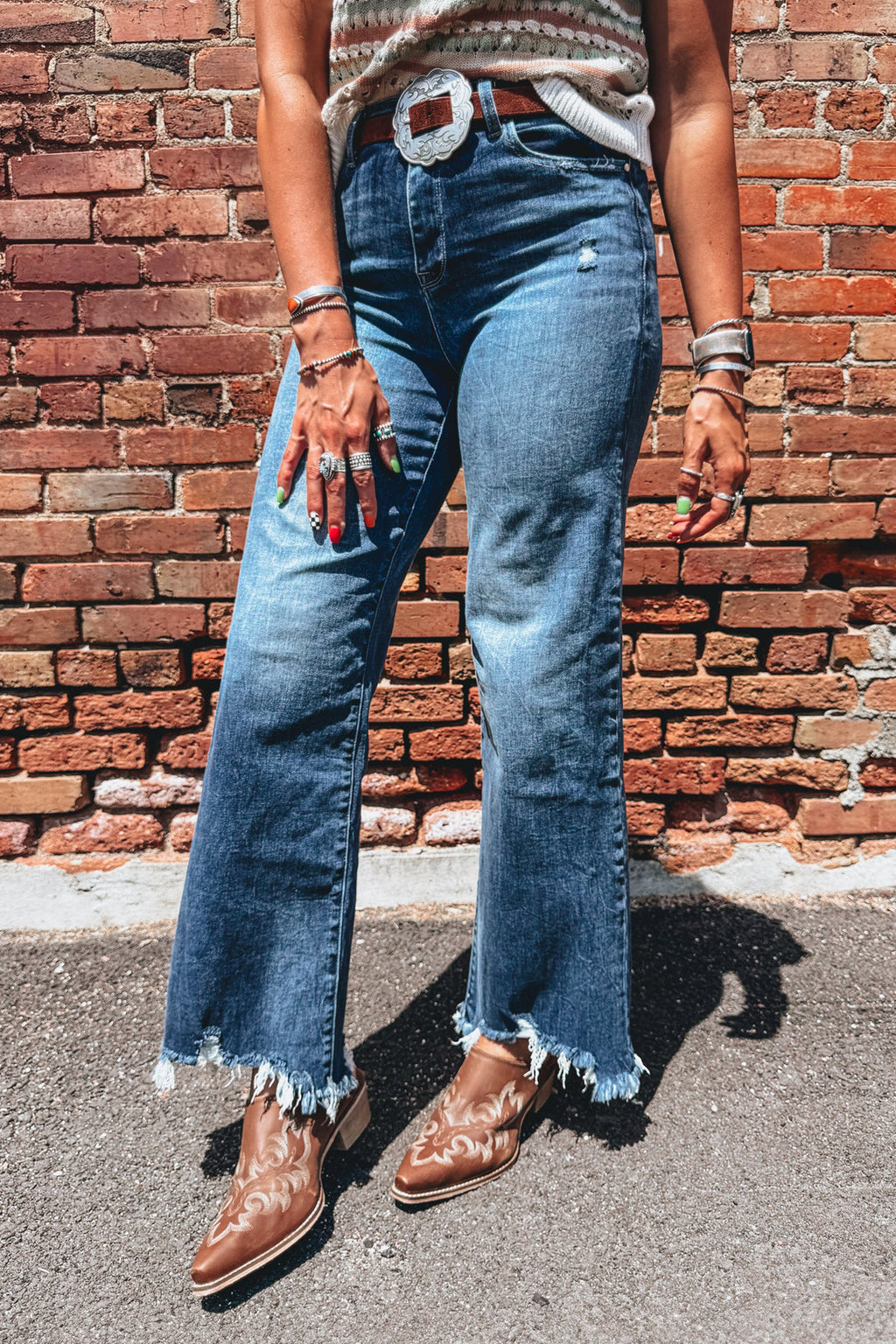 Blue high waist flare jeans with frayed hem from Dear-Lover, showing the stylish fit and distressed detailing.