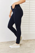 Judy Blue full-size garment dyed tummy control skinny jeans with a close-up of the denim fabric and fit.