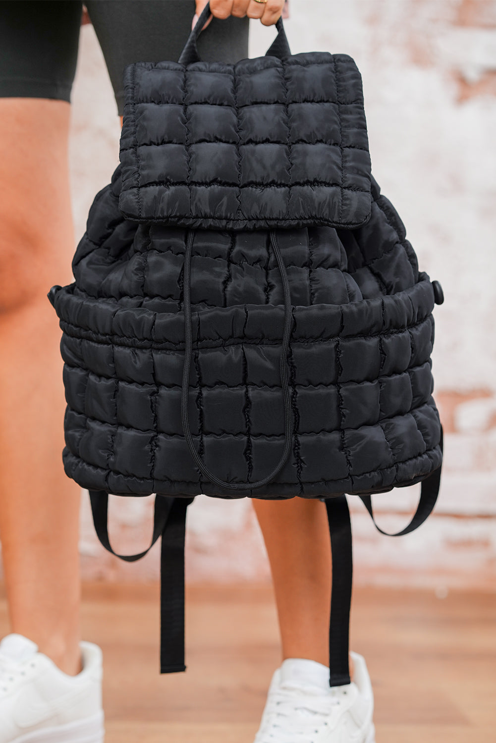 Black Solid Flapped Quilted Puffer Backpack