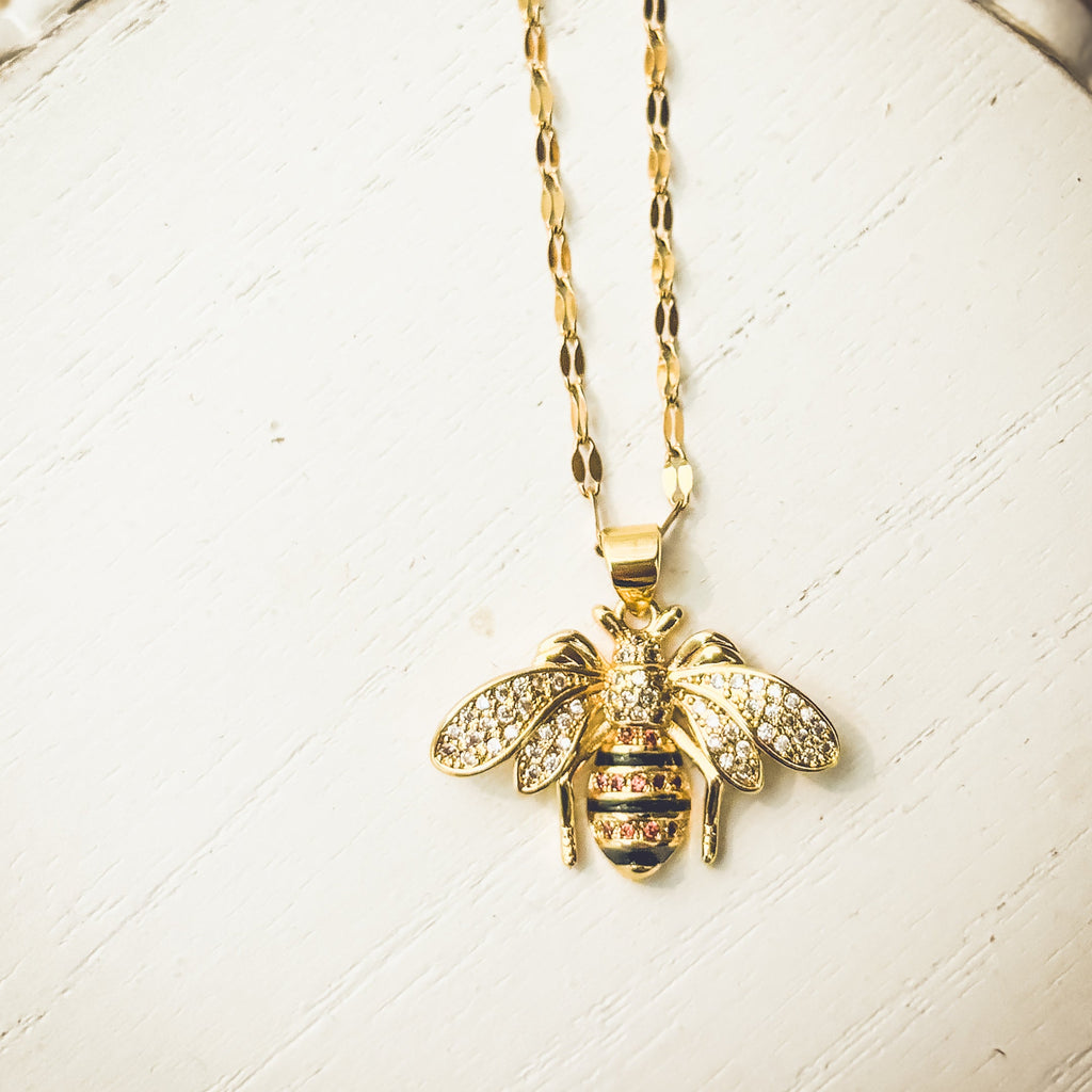 Gold Bumble Bee Necklace from Rooted Home Goods featuring a detailed bee pendant on a delicate chain.