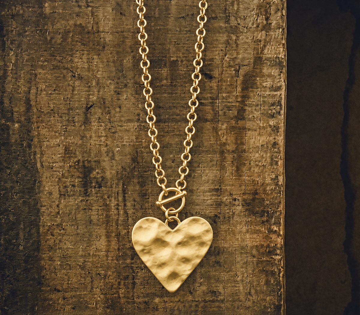 Gold heart necklace from Rooted Home Goods, featuring a delicate pendant on a fine chain, perfect for everyday wear.