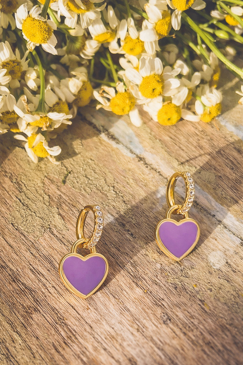 Gold and purple heart-shaped huggie earrings by Rooted Home Goods, featuring a charming design with gold and purple accents.