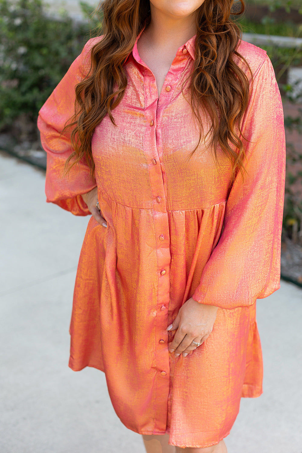 Peach blossom metallic balloon sleeve shirt paired with a plus size mini dress, stylish and vibrant for casual wear.