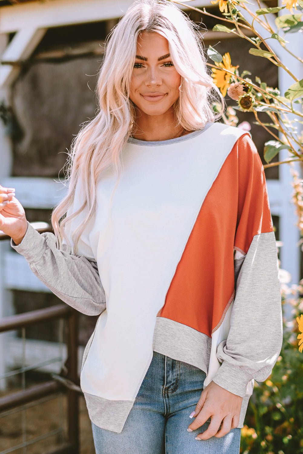 Colorblock stitching irregular hem long sleeve top by Dear-Lover, featuring contrasting colors and stylish design details.