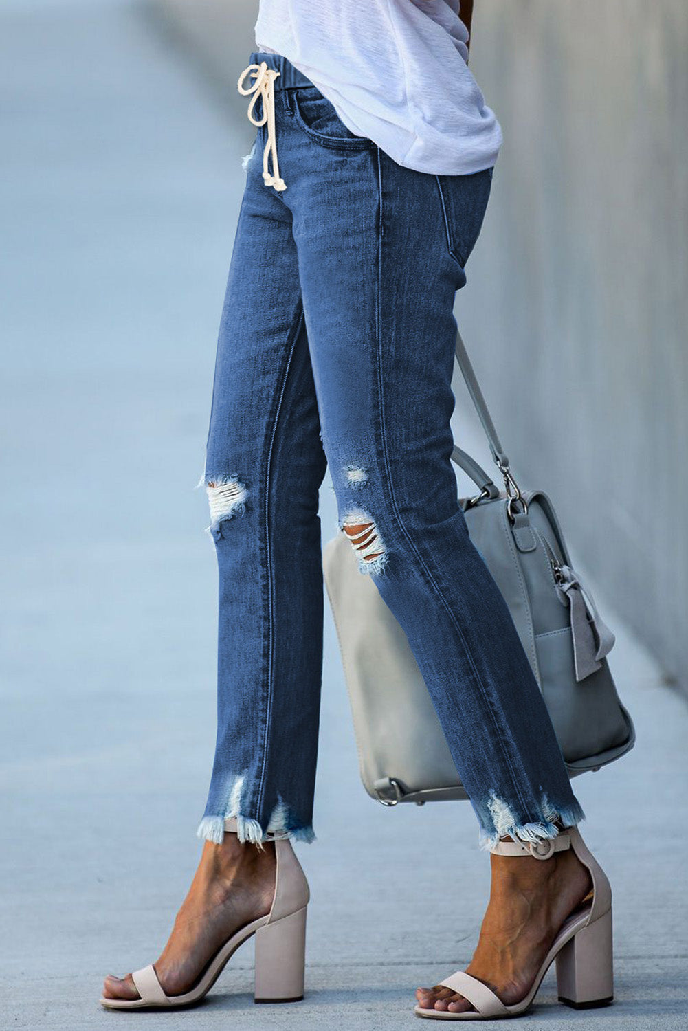 Dark blue Dear-Lover straight leg jeans with elastic waist, destroyed details, and raw hem, showcasing a casual denim style.