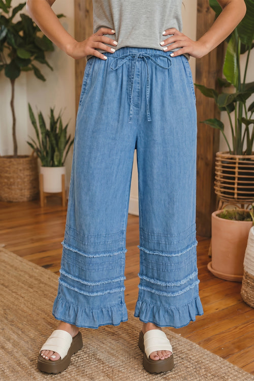 Dusk blue cotton chambray wide-leg pants with ruffled hem from Dear-Lover, featuring a relaxed fit and stylish design.