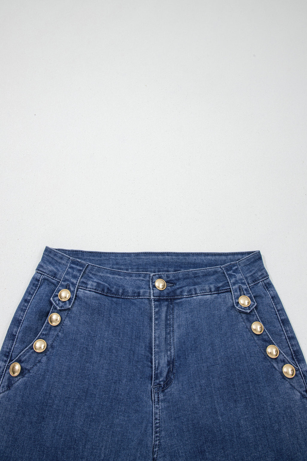 Dear-Lover Ashleigh blue flare jeans with golden button details and rolled edges, featuring a stylish flare leg design.
