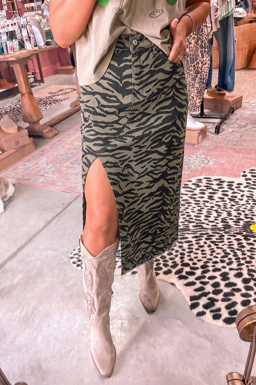 Brown leopard print denim midi skirt with side split and frayed hem, from Dear-Lover. Stylish skirt with bold animal print.